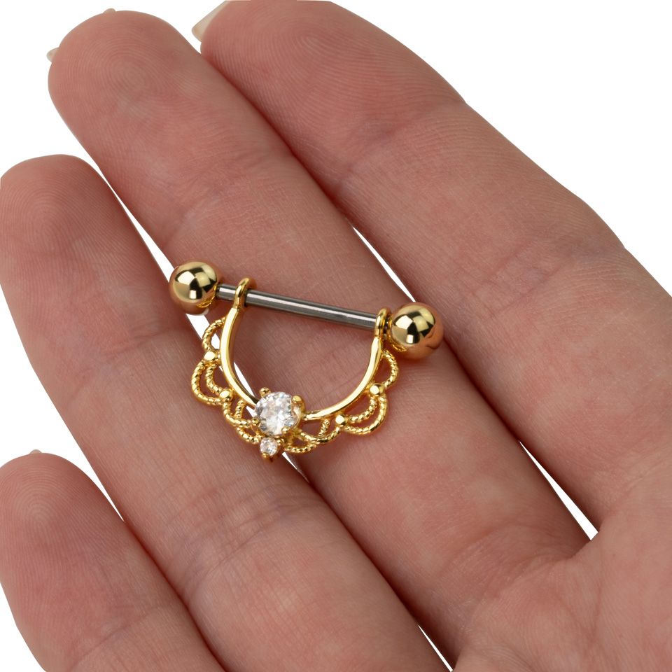 Mell piercing csillogó kővel és filigrán díszítéssel