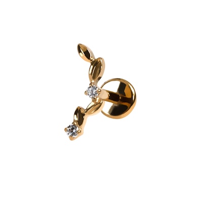 Labret titánból ívesen elhelyezett levelekkel és kövekkel