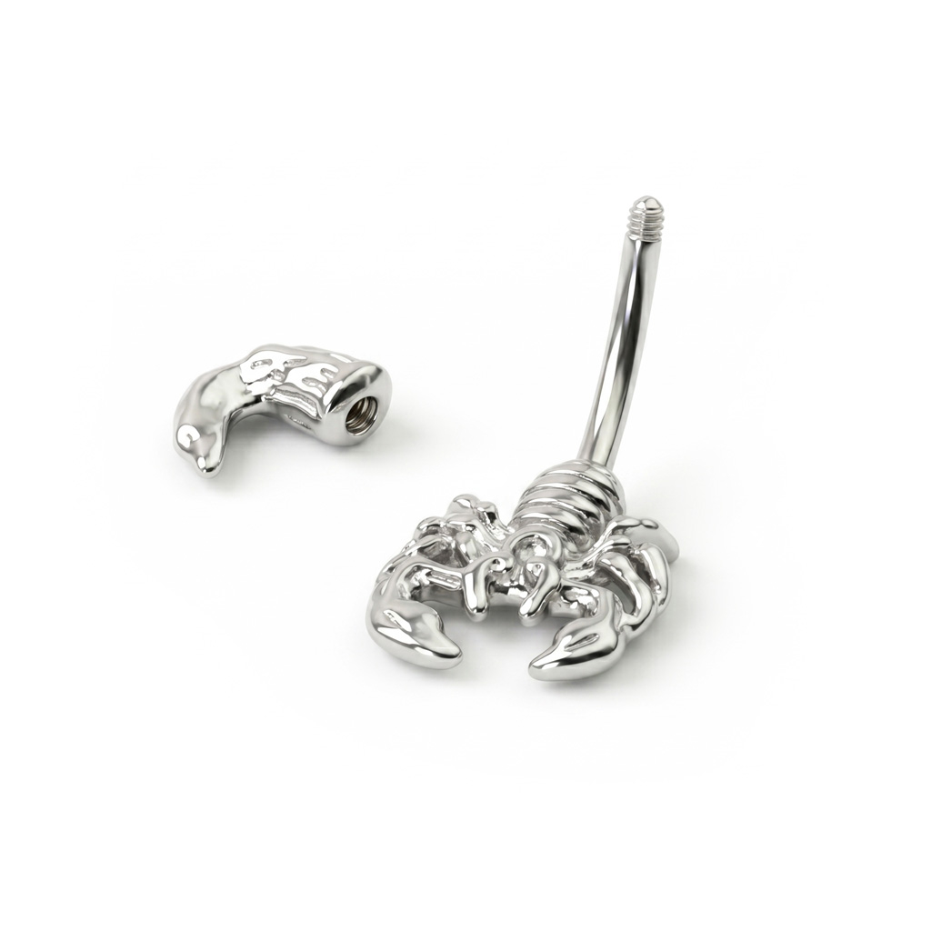 Köldök piercing skorpió dísszel