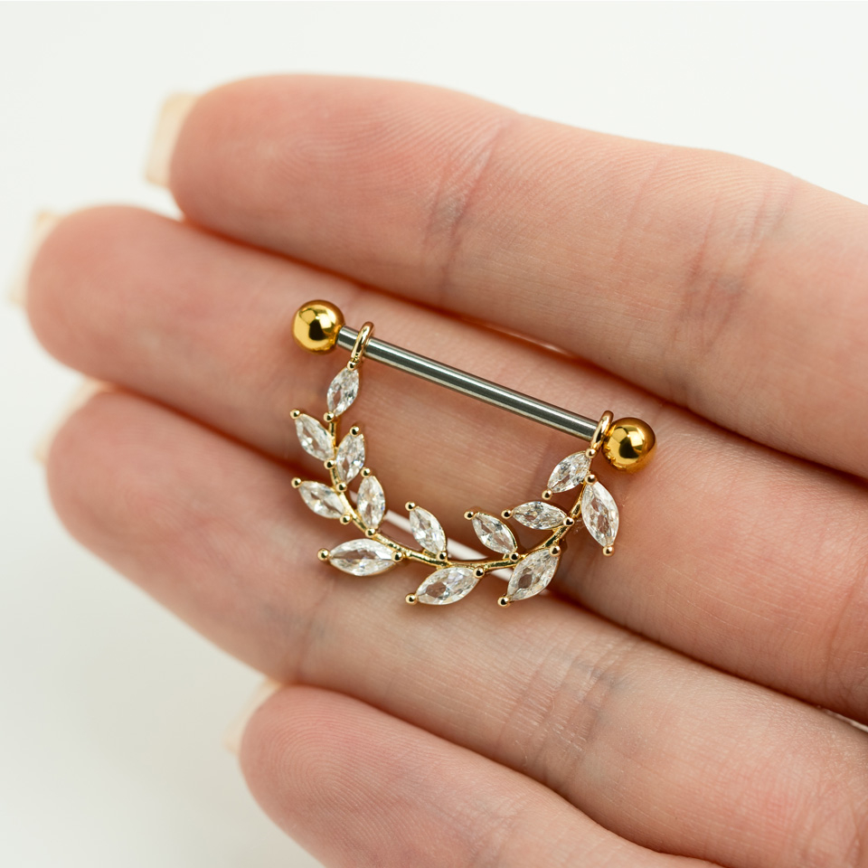 Mell piercing levelekkel és kövekkel díszítve