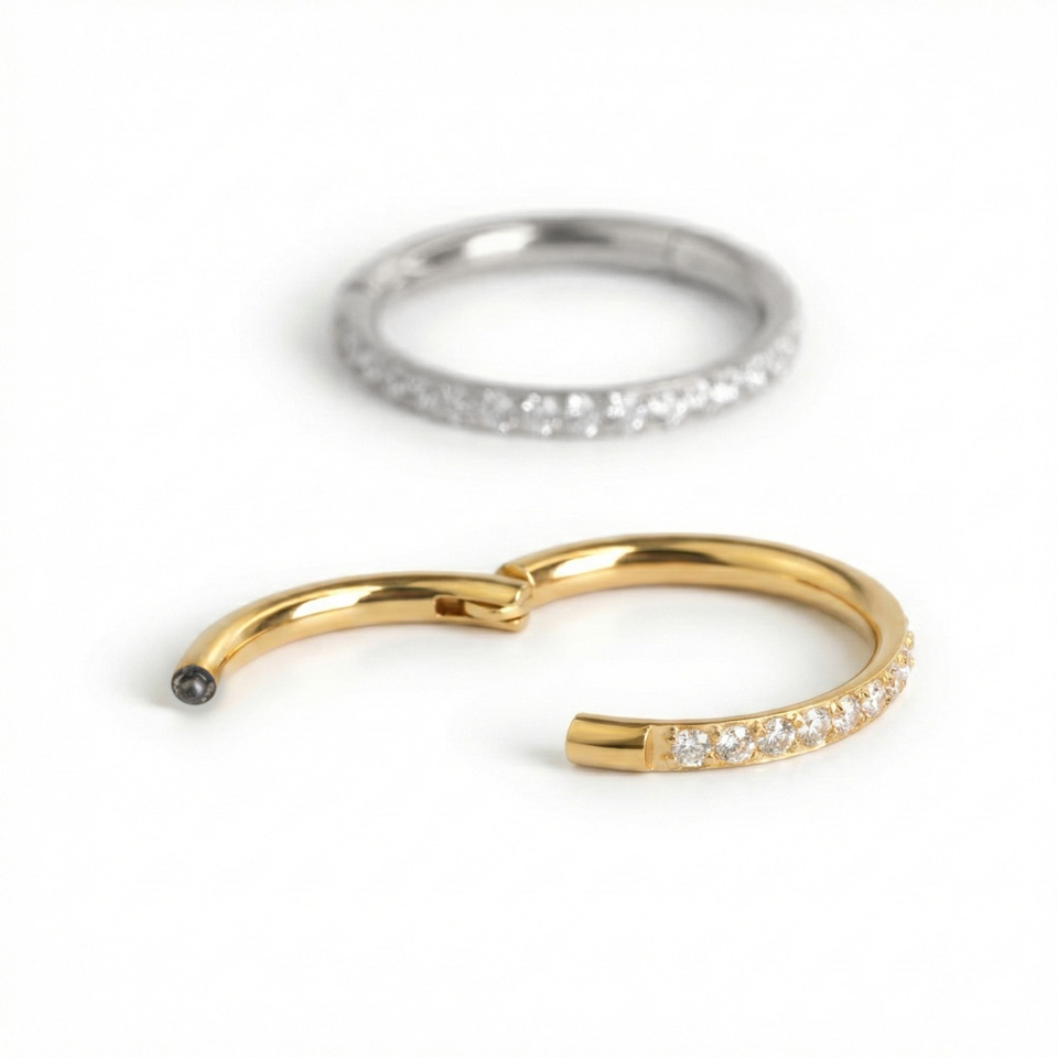 Csuklós karika orvosi acélból, kifelé néző kövekkel